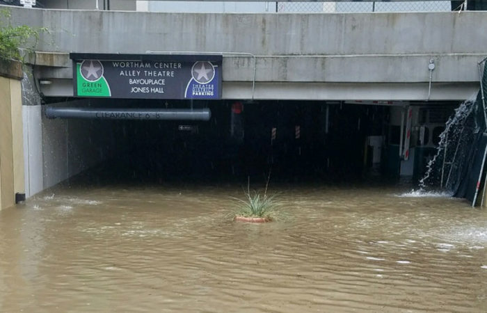 A heavily flooded underground parking facility in Houston's theater district.