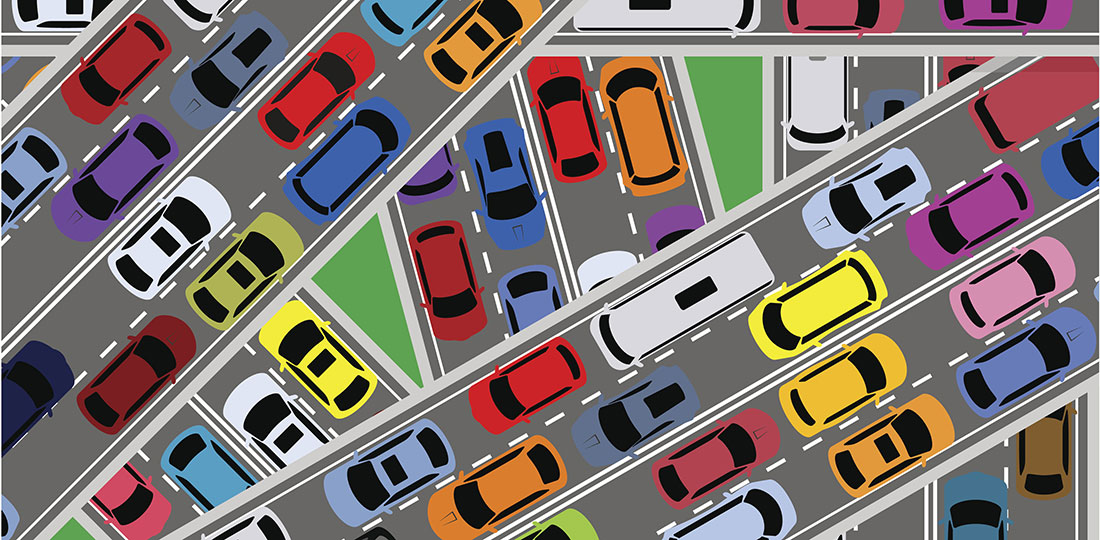 Bumper-to-bumper traffic at a freeway interchange. Illustration.